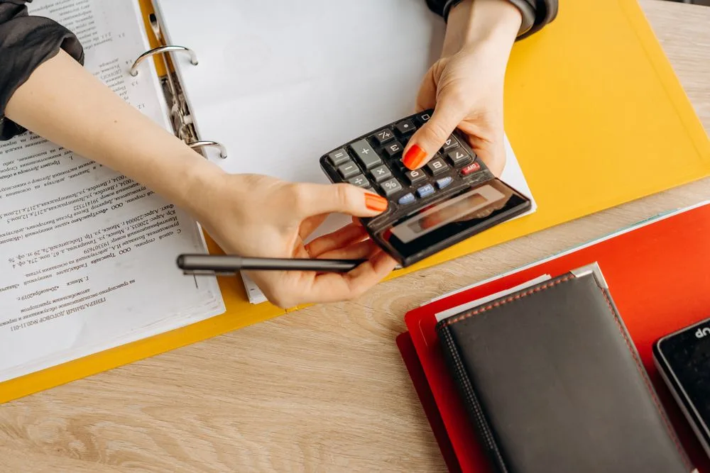 Calculating costs alongside financial paperwork